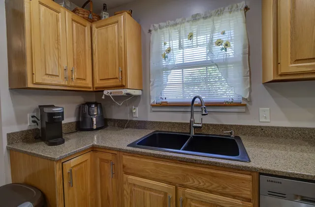 a kitchen with a sink and cabinets