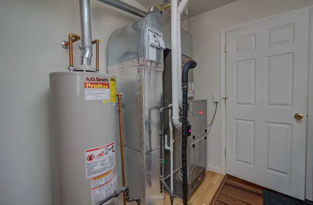 a view of storage and utility room with closet