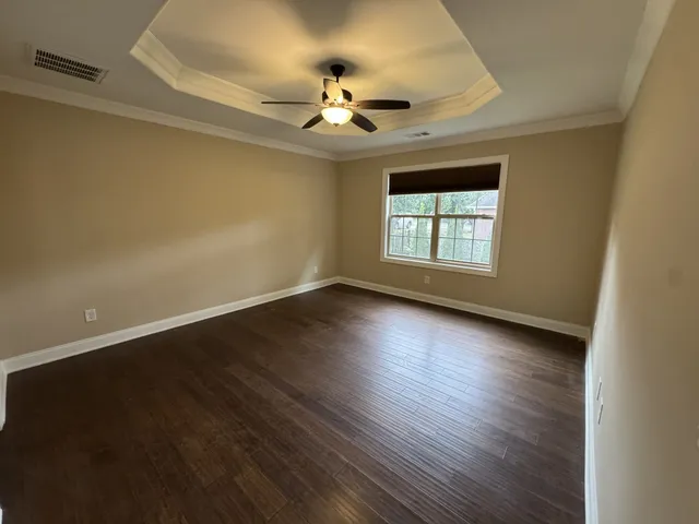 a bathroom with a tub and a double vanity sink