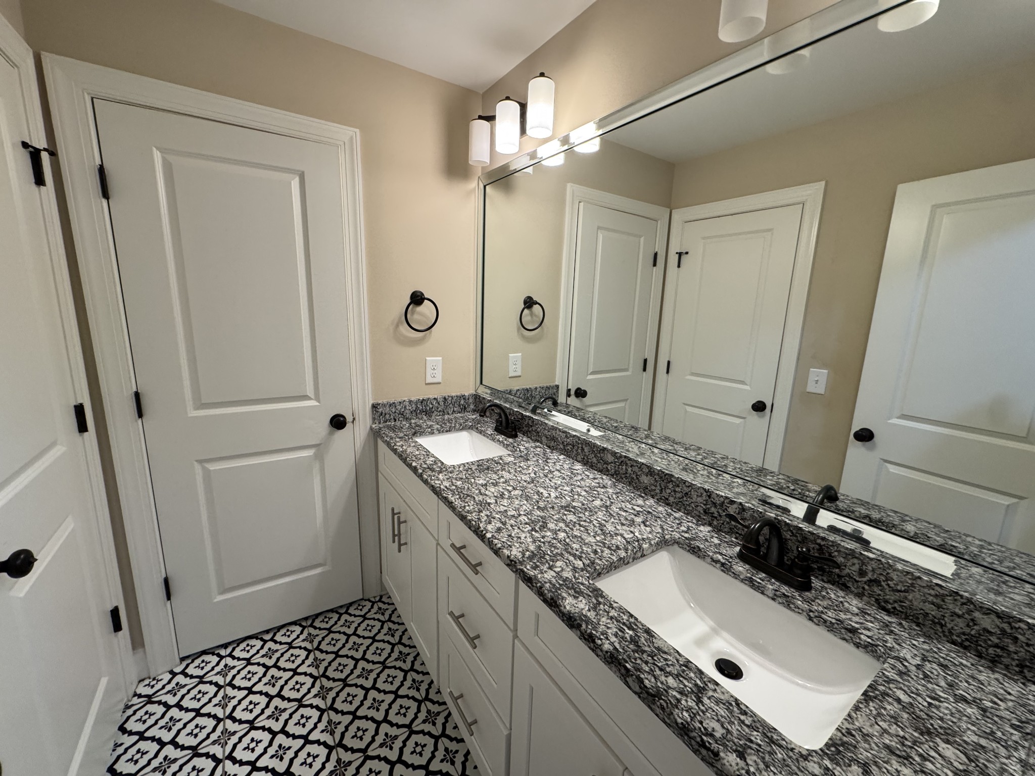 2006 Eagle View Road Hendersonville, TN 37075 - Photo 25 of 28 a bathroom with a granite countertop sink and a mirror