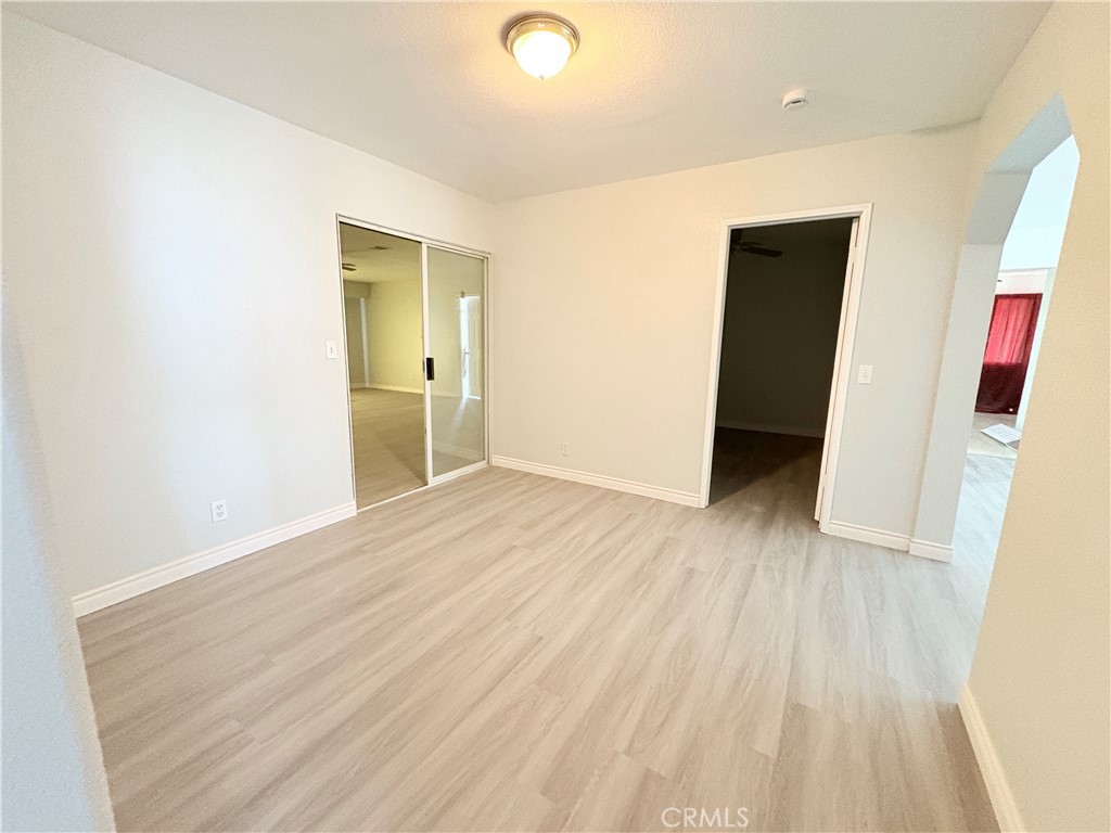 14027 Navajo Road Apple Valley, CA 92307 - Photo 13 of 25 a view of hallway with wooden floor
