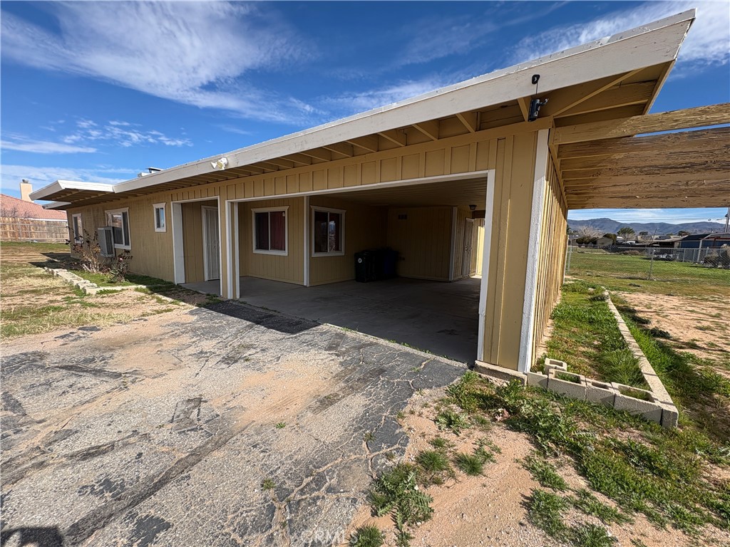 14027 Navajo Road Apple Valley, CA 92307 - Photo 24 of 25 a view of a house with a yard