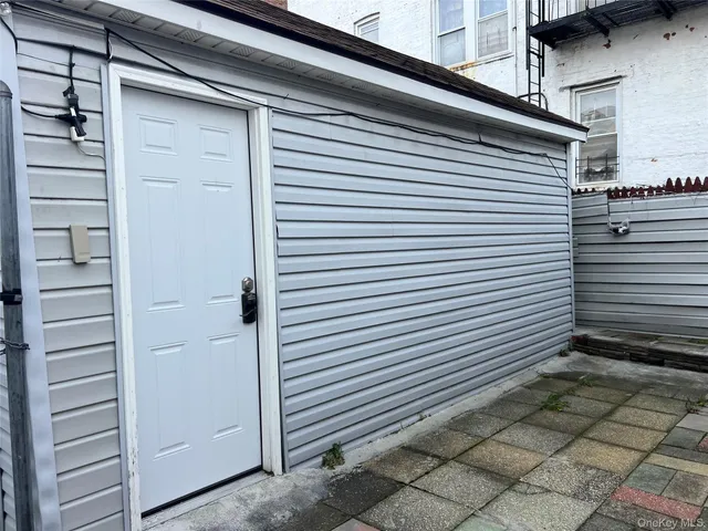 a view of a house with a wooden fence