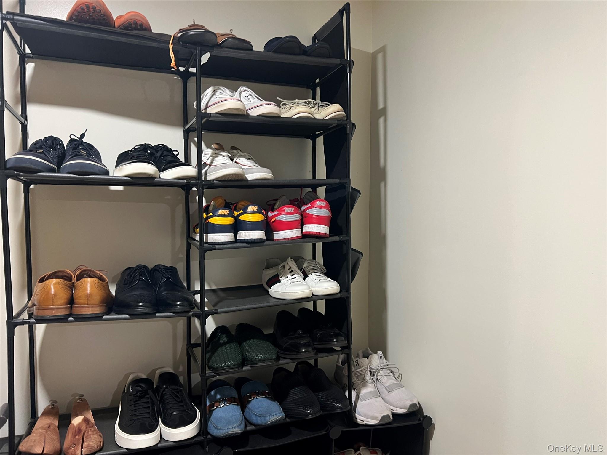 151-08 33rd Road Queens, NY 11354 - Photo 20 of 22 a room with lots of different colored cloths