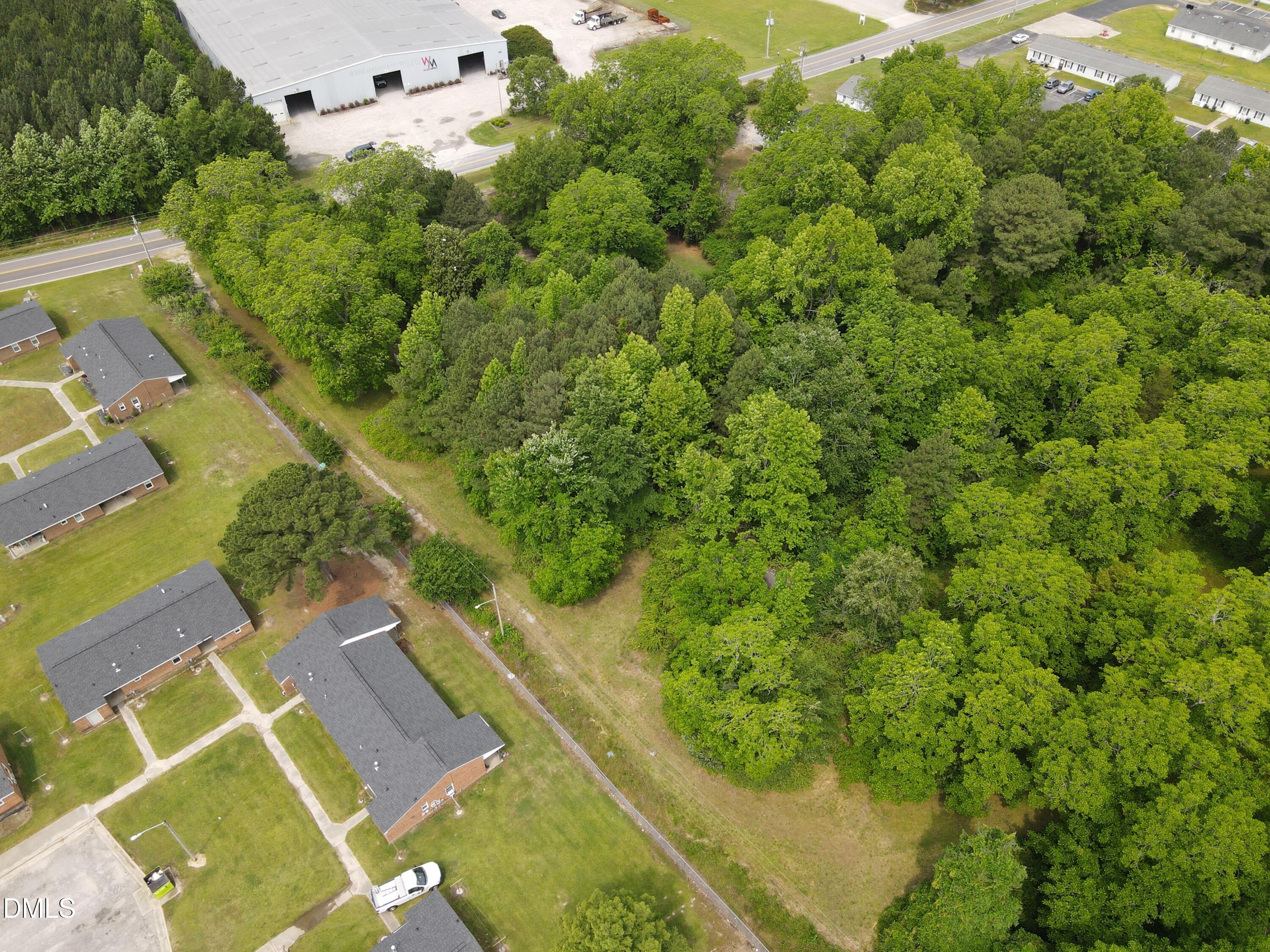 1708-1710 London Church Road Northeast Wilson, NC 27893 - Photo 14 of 27 an aerial view of a house with a yard swimming pool outdoor seating and yard
