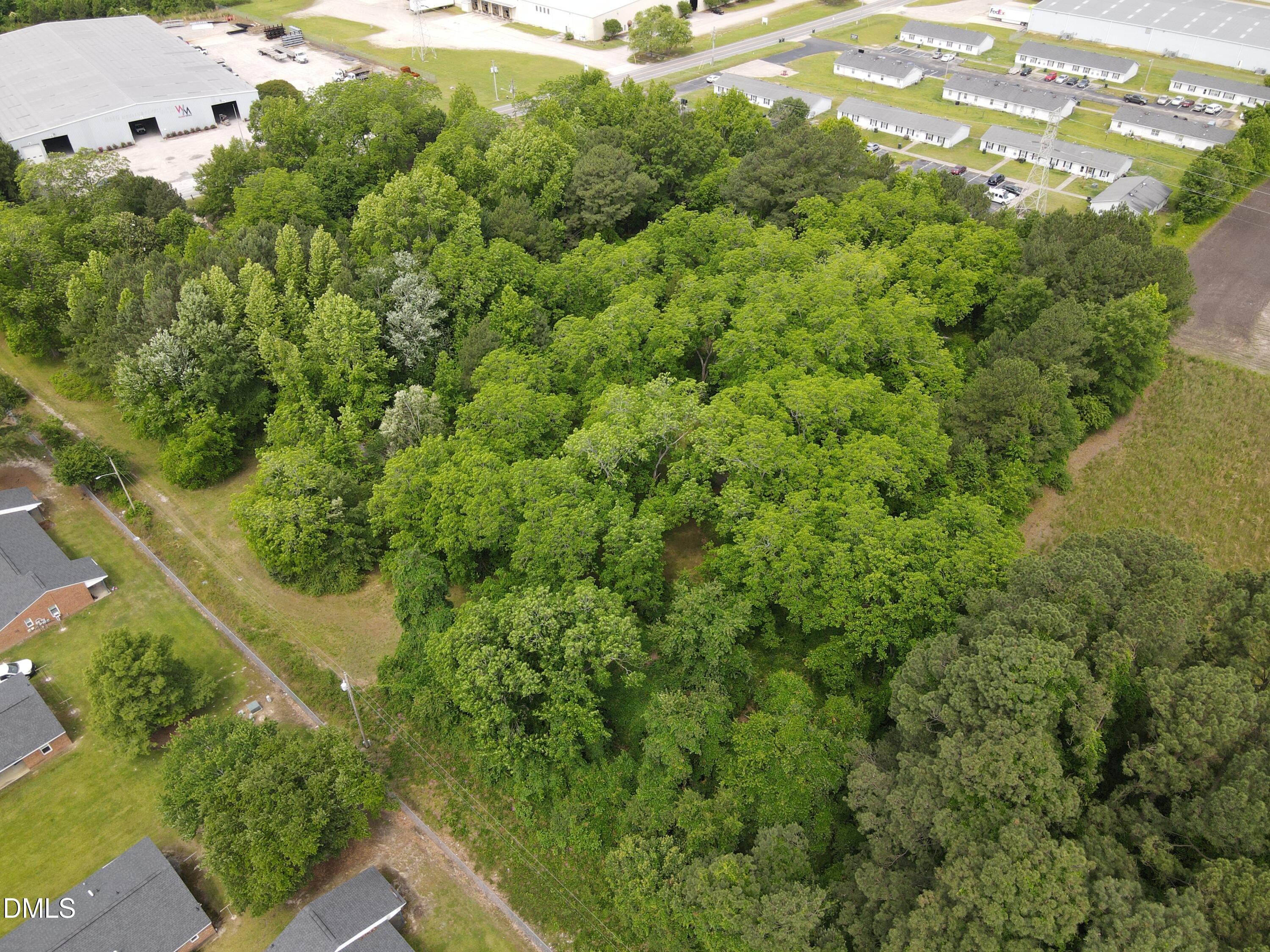 1708-1710 London Church Road Northeast Wilson, NC 27893 - Photo 20 of 27 an aerial view of residential house with outdoor space and trees all around