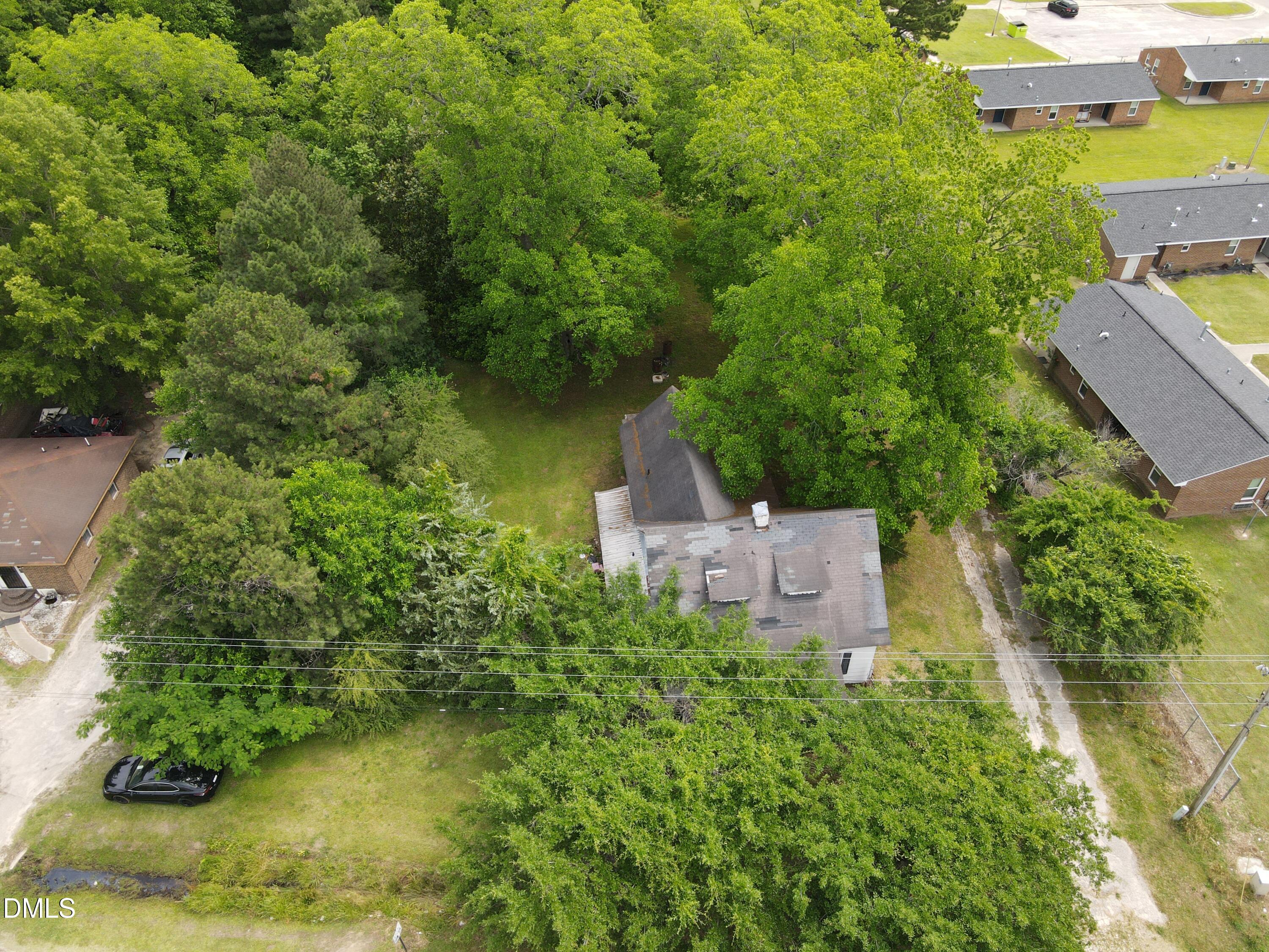 1708-1710 London Church Road Northeast Wilson, NC 27893 - Photo 3 of 27 an aerial view of a house with a yard basket ball court and outdoor seating