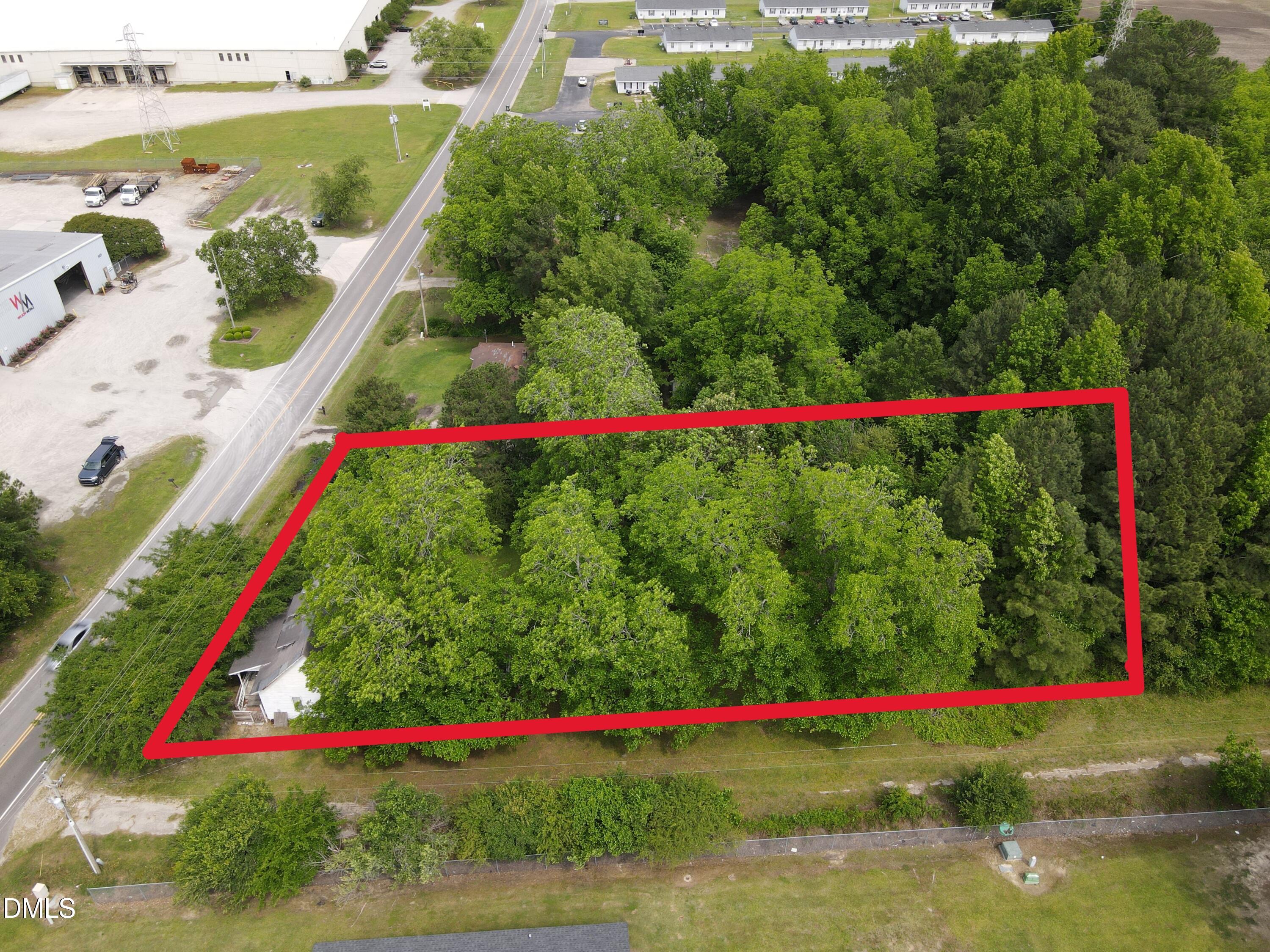 1708-1710 London Church Road Northeast Wilson, NC 27893 - Photo 8 of 27 a view of a yard with plants and large trees