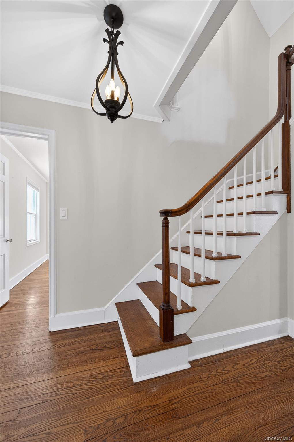108 La Rue Drive Huntington, NY 11743 - Photo 16 of 27 Stairs to second floor featuring wood finished floors and ornamental molding