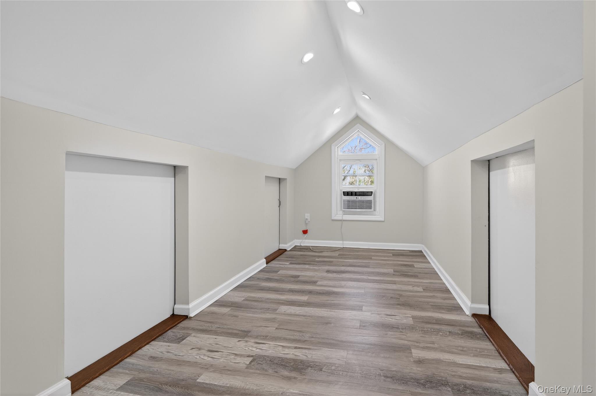 108 La Rue Drive Huntington, NY 11743 - Photo 21 of 27 Den featuring light wood-type flooring and storage closets