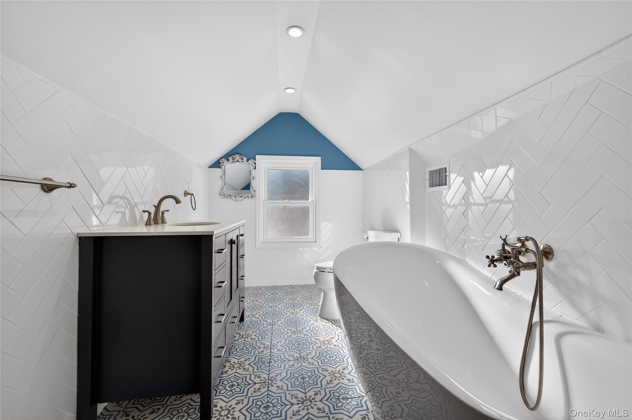 108 La Rue Drive Huntington, NY 11743 - Photo 23 of 27 Full bathroom with vanity, a soaking tub, tile walls, and recessed lighting