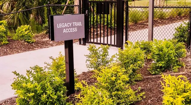 a sign that is on a brick wall