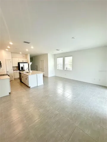 a view of a kitchen with furniture and a window