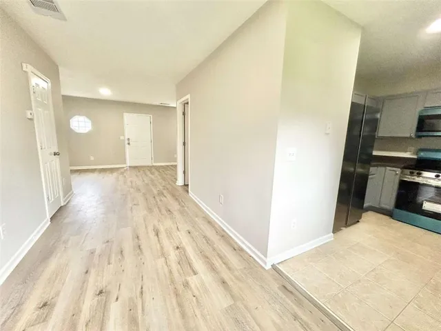 a view of a kitchen with wooden floor