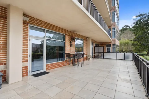 a front view of a building with garden