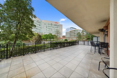 a view of a terrace with chairs