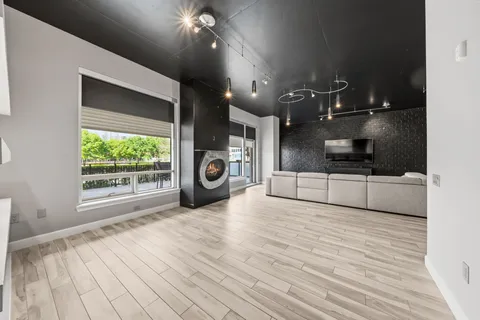a view of a kitchen with a sink and a stove top oven
