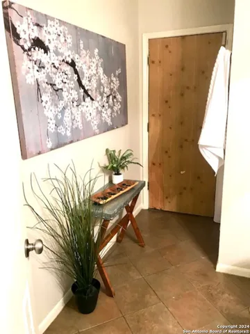 a white toilet sitting next to a sink