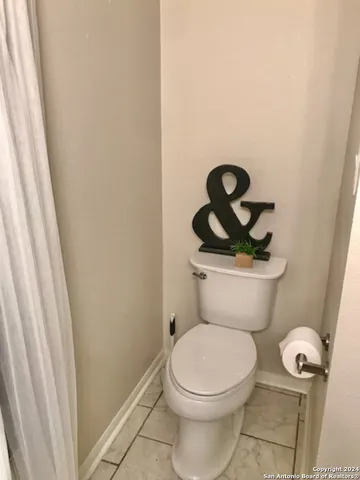 a bathroom with a tub sink and vanity