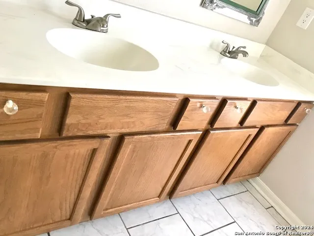 a bathroom with a glass shower door