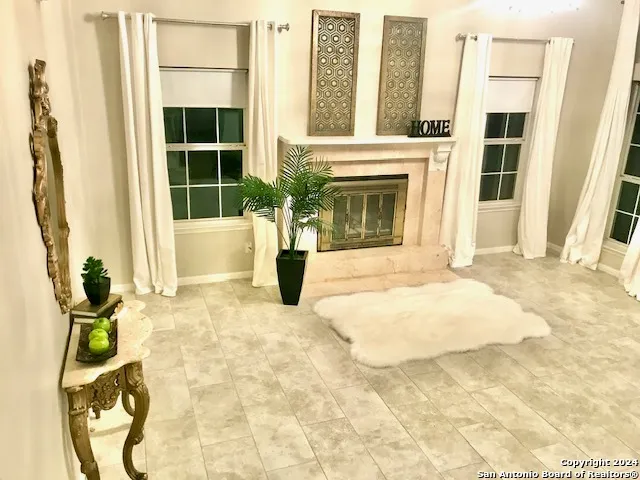 a view of empty room with floor to ceiling window