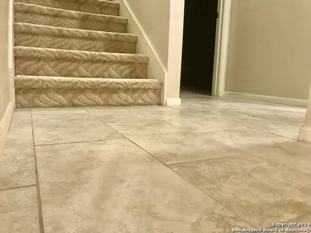 a blue bench sitting in front of a bathroom