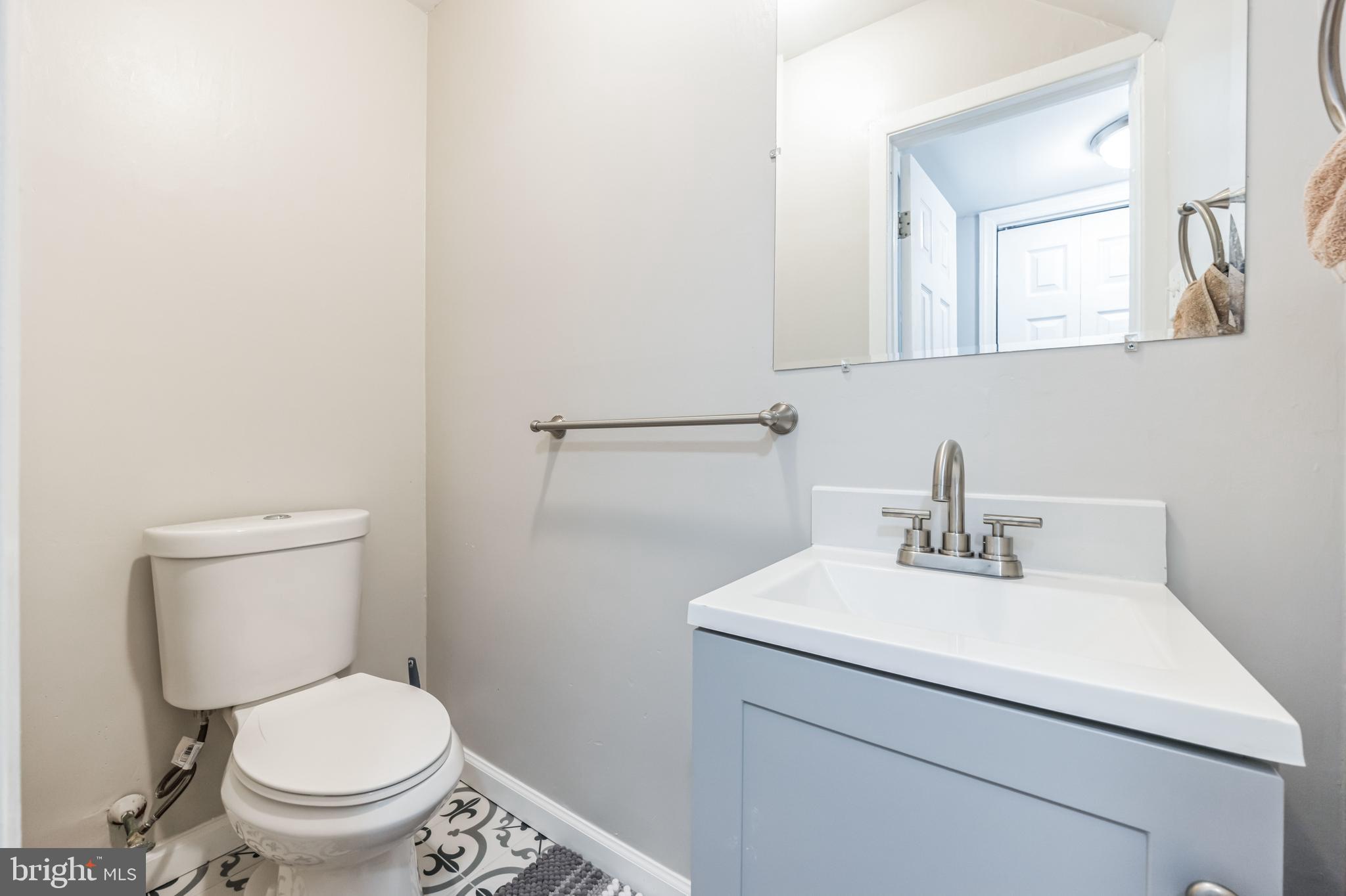 23 Raleigh Place Willingboro, NJ 08046 - Photo 17 of 27 a bathroom with a sink toilet and a mirror