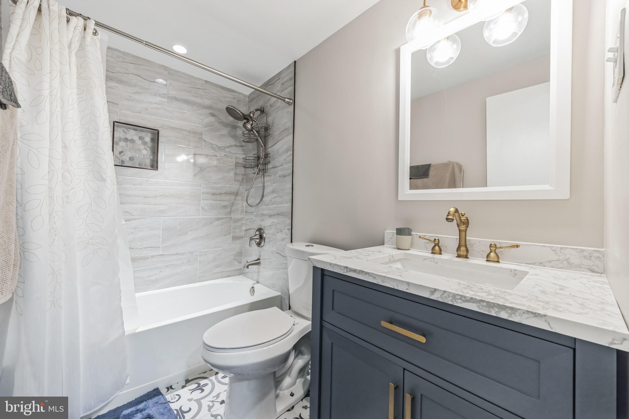 23 Raleigh Place Willingboro, NJ 08046 - Photo 22 of 27 a bathroom with a granite countertop sink toilet and shower