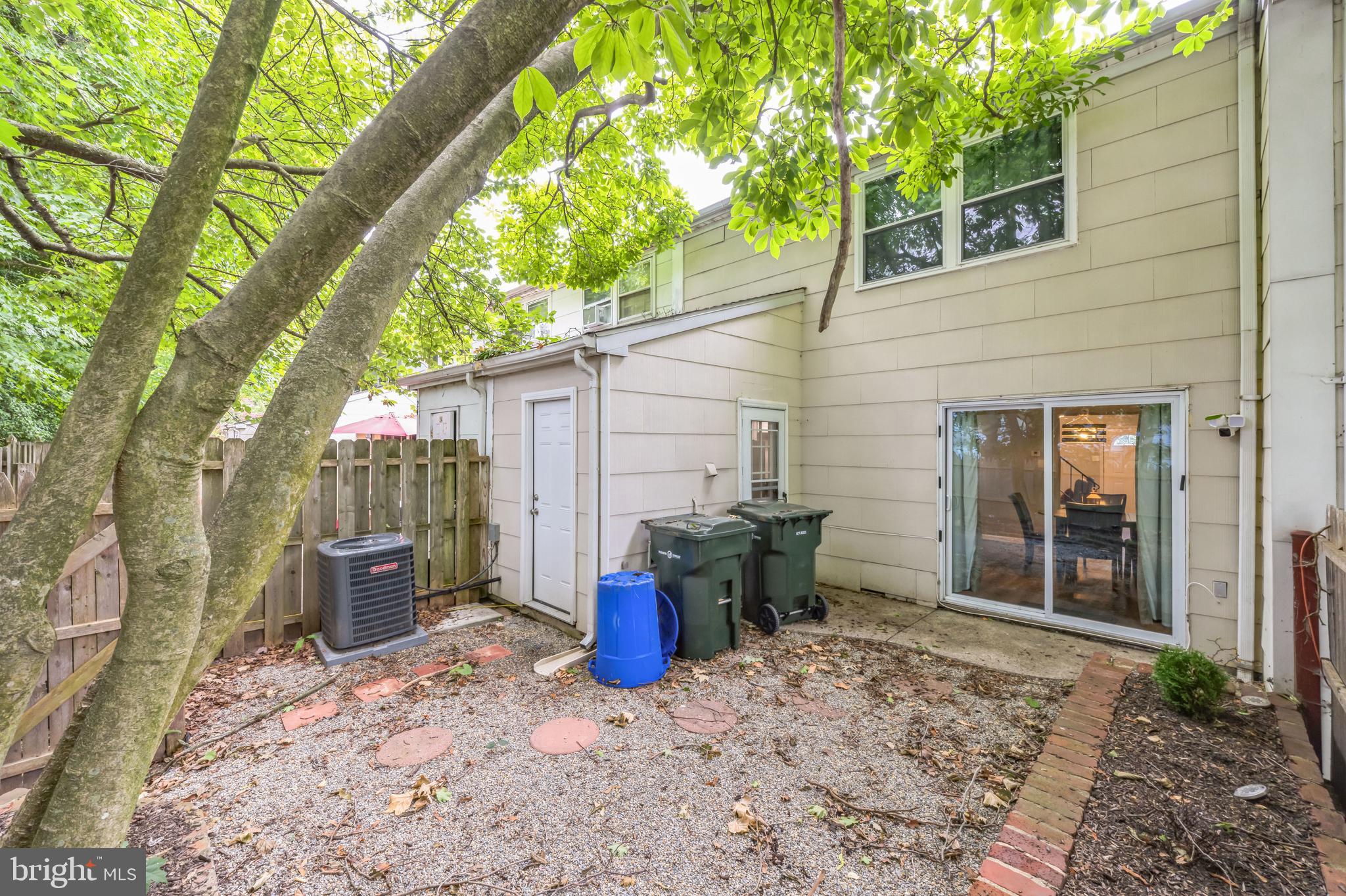 23 Raleigh Place Willingboro, NJ 08046 - Photo 25 of 27 a backyard of a house with barbeque oven table and chairs