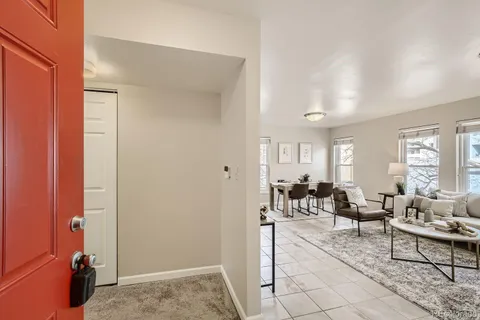 a living room with furniture and a table