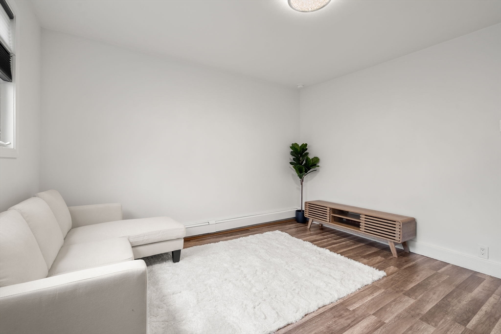 20 Pleasant View Avenue Everett, MA 02149 - Photo 14 of 22 a living room with a couch