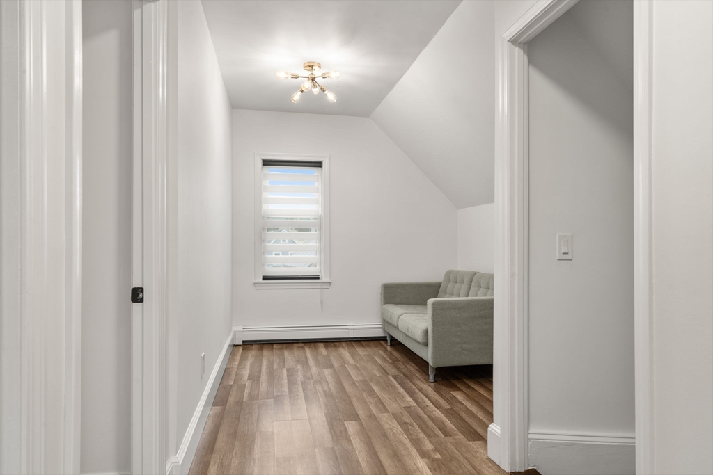 20 Pleasant View Avenue Everett, MA 02149 - Photo 16 of 22 a living room with a bed furniture and a window