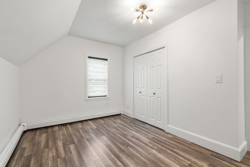 20 Pleasant View Avenue Everett, MA 02149 - Photo 22 of 22 wooden floor in an empty room with a window