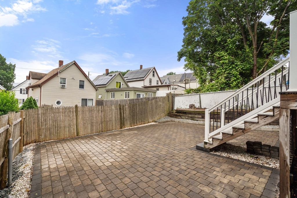 20 Pleasant View Avenue Everett, MA 02149 - Photo 10 of 22 a view of a house with wooden fence