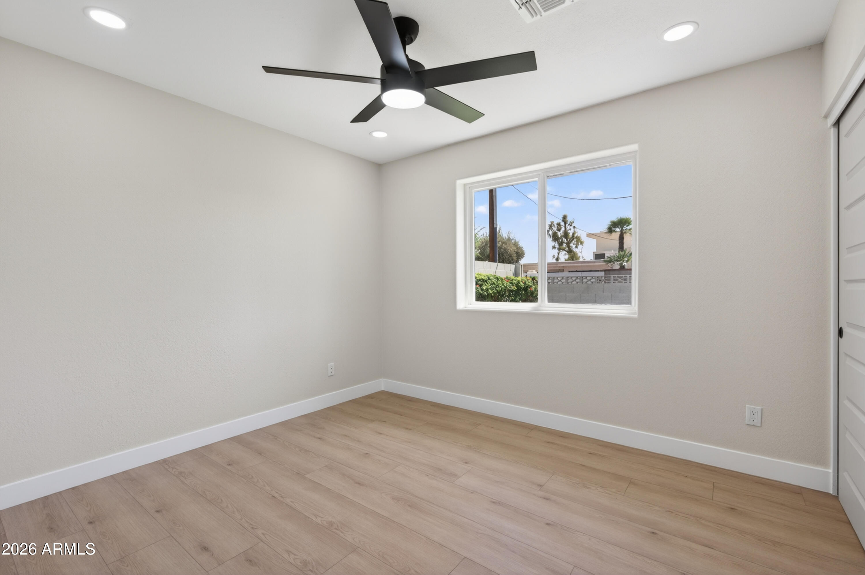3422 South Terrace Road Tempe, AZ 85282 - Photo 25 of 43 a view of empty room with wooden floor