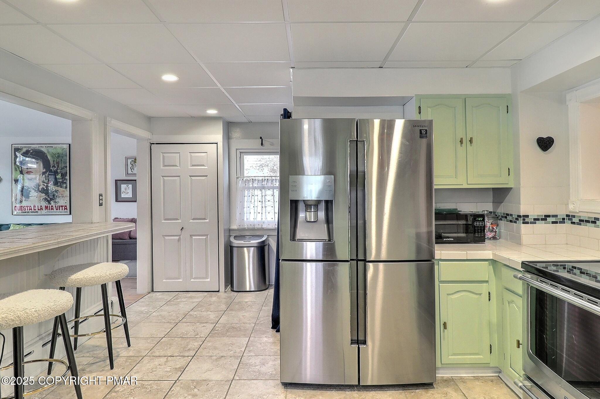 541 Barry Street Stroudsburg, PA 18360 - Photo 13 of 49 a kitchen with stainless steel appliances granite countertop a refrigerator and a stove top oven