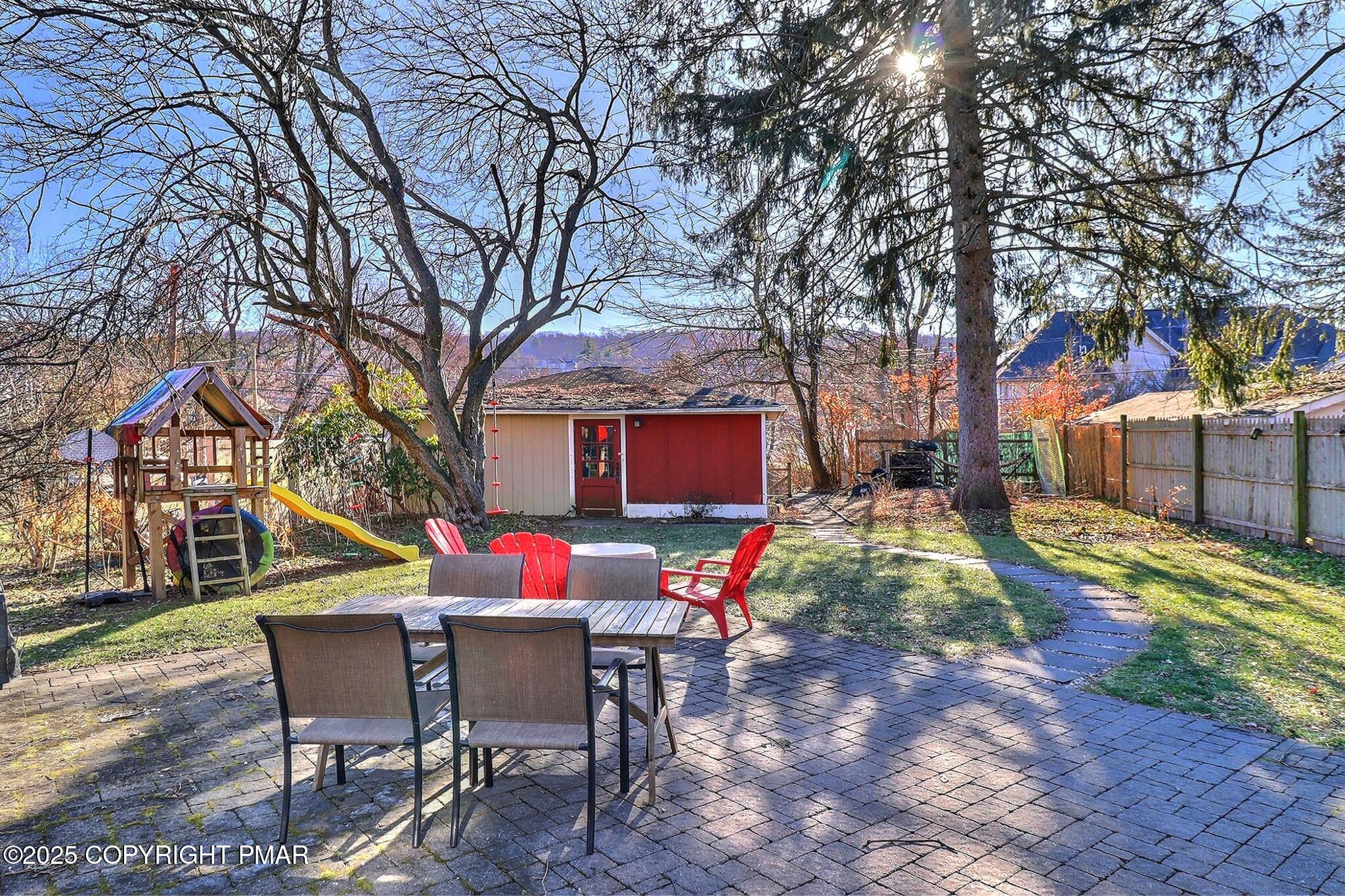 541 Barry Street Stroudsburg, PA 18360 - Photo 4 of 49 a backyard of a house with table and chairs