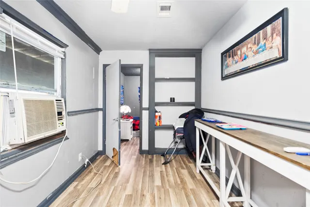 a bathroom with a shower and a sink