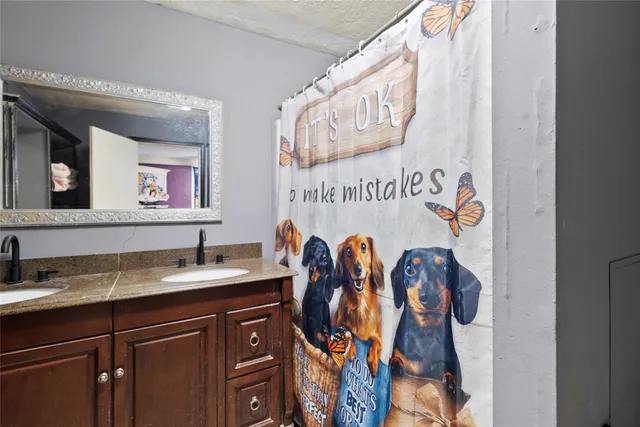 a view of a room with wooden floor and furniture
