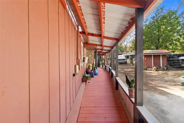 a view of a porch and wooden floor