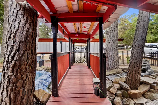 a view of a house with swimming pool and sitting area