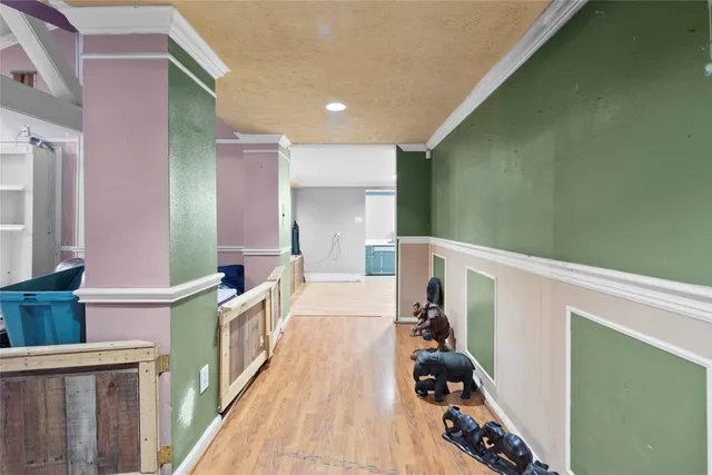 a large kitchen with granite countertop a refrigerator stove and oven