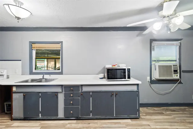 a view of kids room with toys and wooden floor