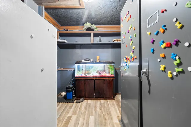 a view of an entryway with wooden floor