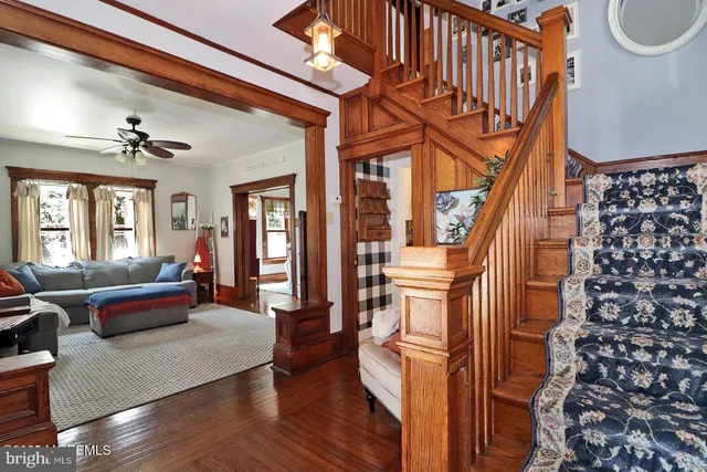 a view of entryway with wooden floor and stairs