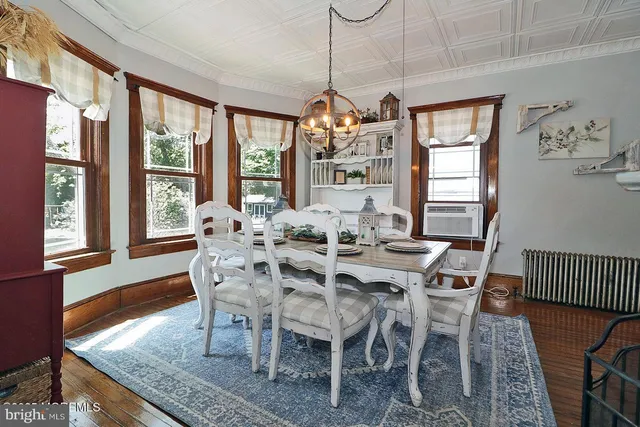 a view of a livingroom with furniture and wooden floor