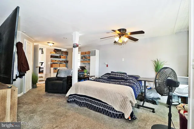 a view of kitchen with microwave and cabinets
