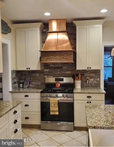 a kitchen with a sink and a refrigerator