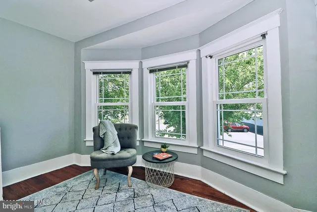 a bedroom with a bed and a television