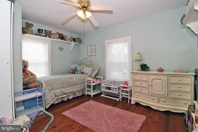 a bedroom with furniture and a chandelier